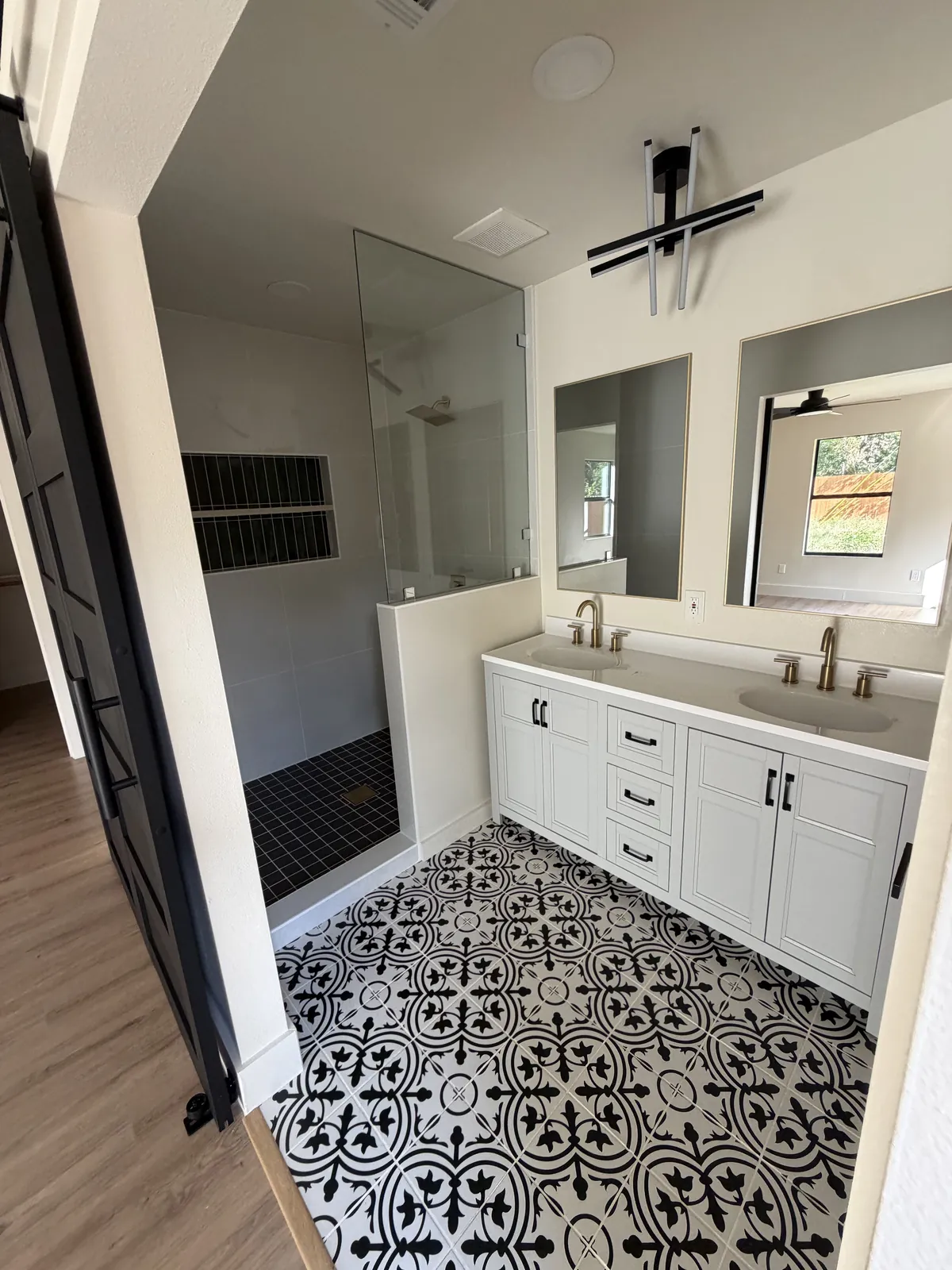 Black and white patterned tile set in a bathroom
