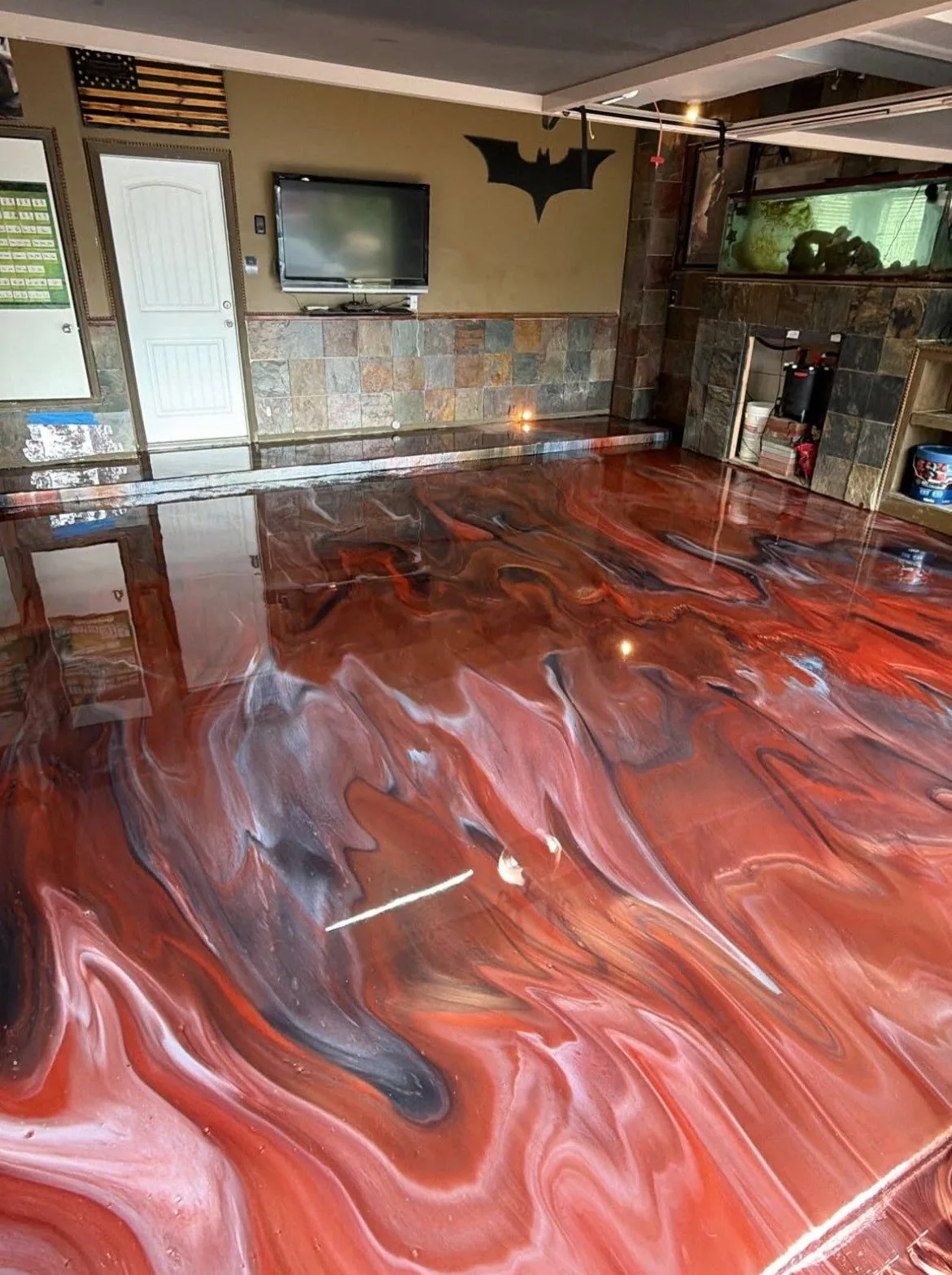 Themed residential garage with a copper metallic epoxy floor